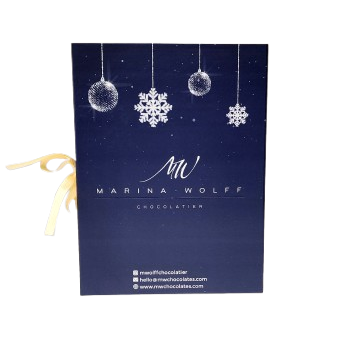 A beautifully wrapped Christmas gift box featuring snowflake designs and a decorative ribbon on top.