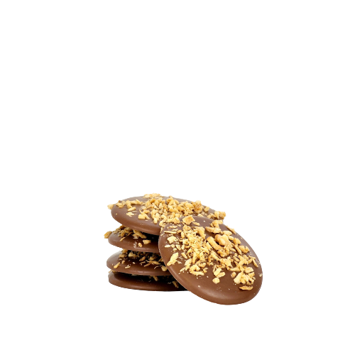 A pile of 5 milk chocolate disks topped with toasted coconut